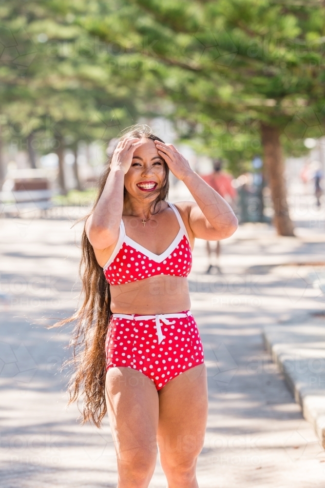 happy asian woman in bikini - Australian Stock Image