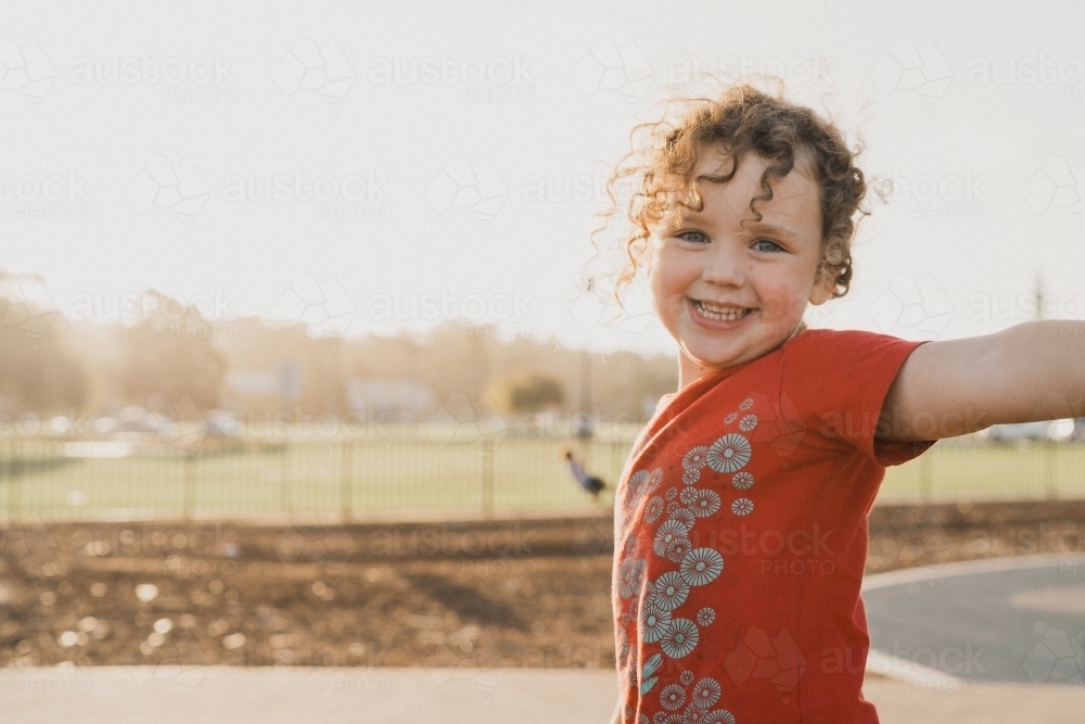 happy child at sunset - Australian Stock Image