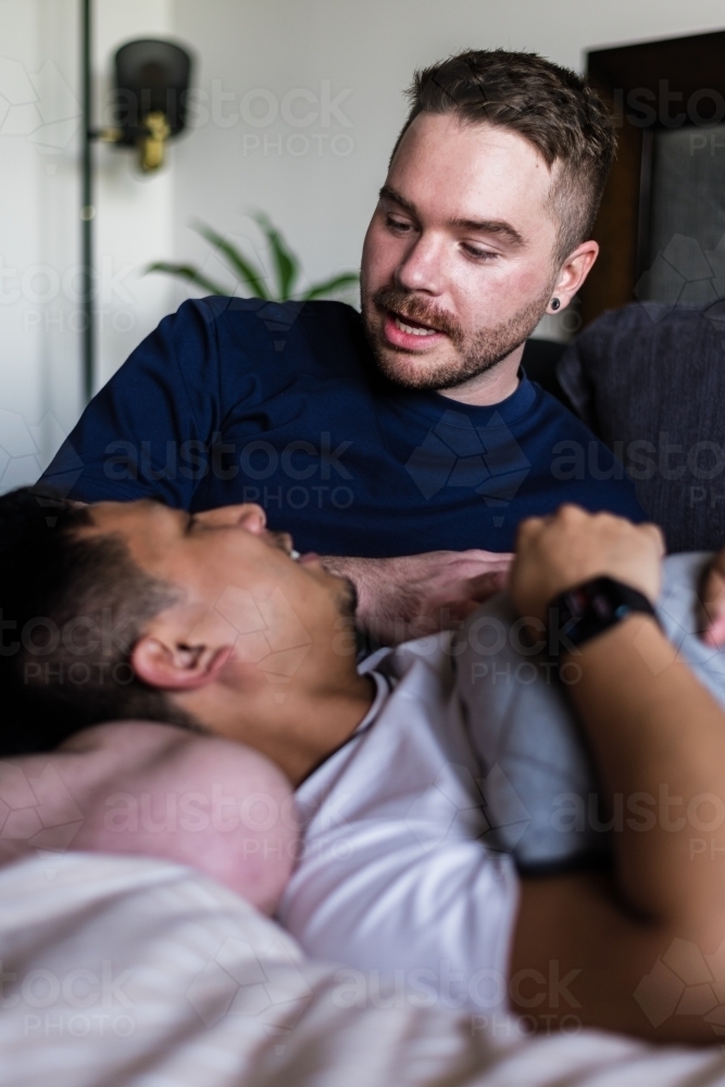 happy couple hanging out at home - Australian Stock Image