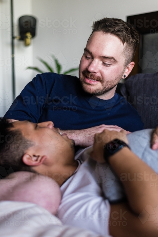 happy couple hanging out at home - Australian Stock Image