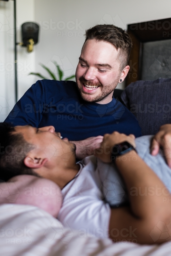 happy couple hanging out at home - Australian Stock Image