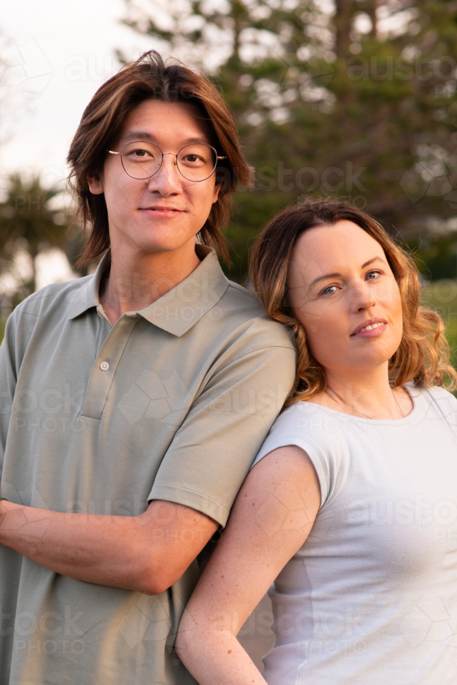happy couple posing in the park - Australian Stock Image