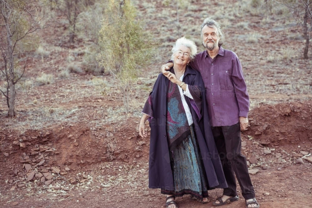 Happy elderly couple holding hands - Australian Stock Image