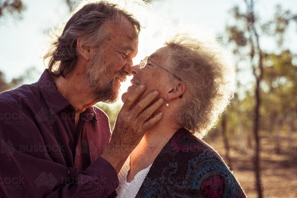 Happy elderly couple kiss in the Northern Territory - Australian Stock Image