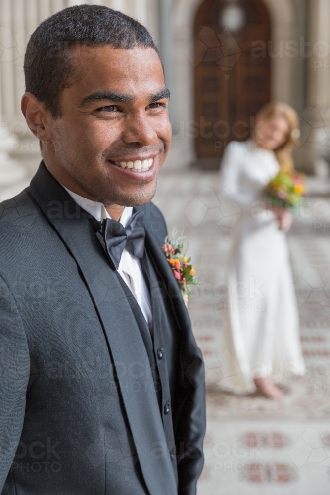 Happy groom grinning - Australian Stock Image