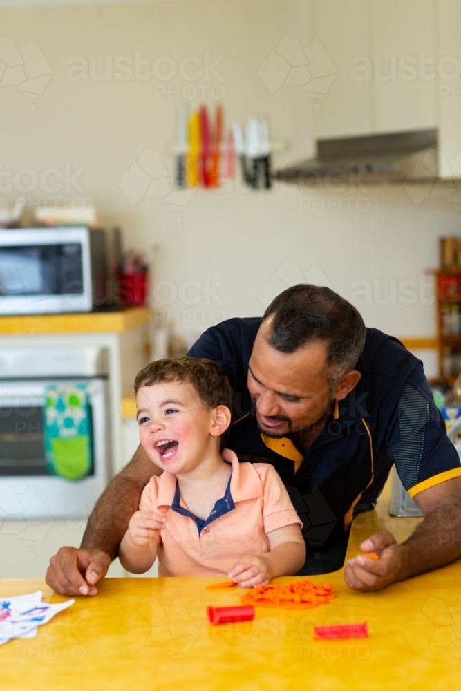 happy little boy with his dad in the kitchen : Austockphoto happy little boy with his dad in the kitchen - Australian Stock Image