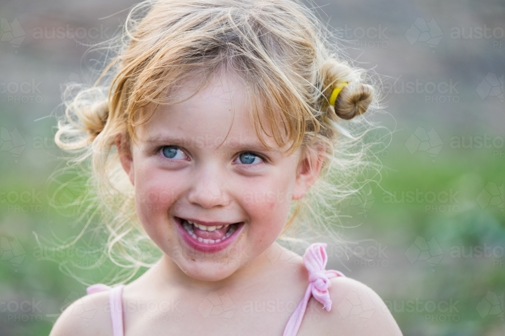Happy little girl with a dirty face - Australian Stock Image