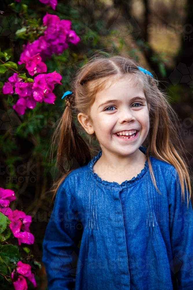 Happy little girl with gap in teeth from first lost tooth - Australian Stock Image