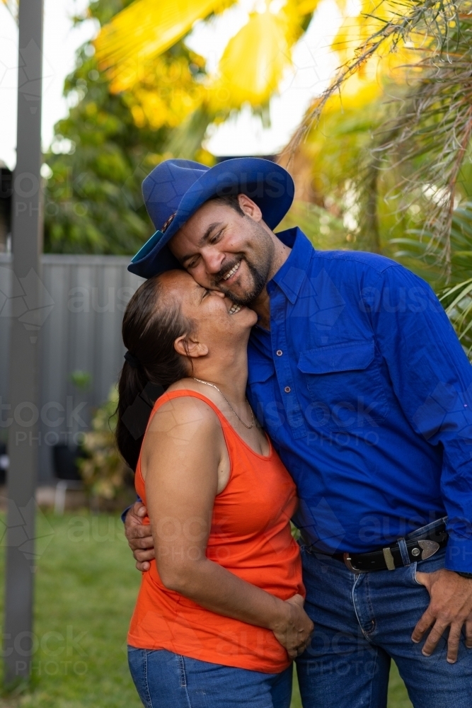 happy loving couple standing close together - Australian Stock Image