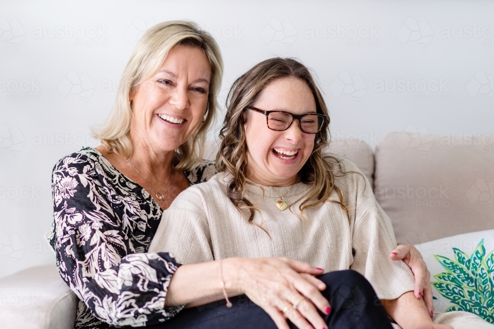 happy mother and daughter , from a series featuring a young woman with Down Syndrome - Australian Stock Image