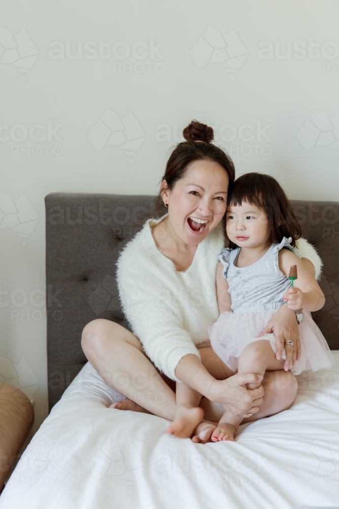 happy mother and daughter spending quality time at home - Australian Stock Image