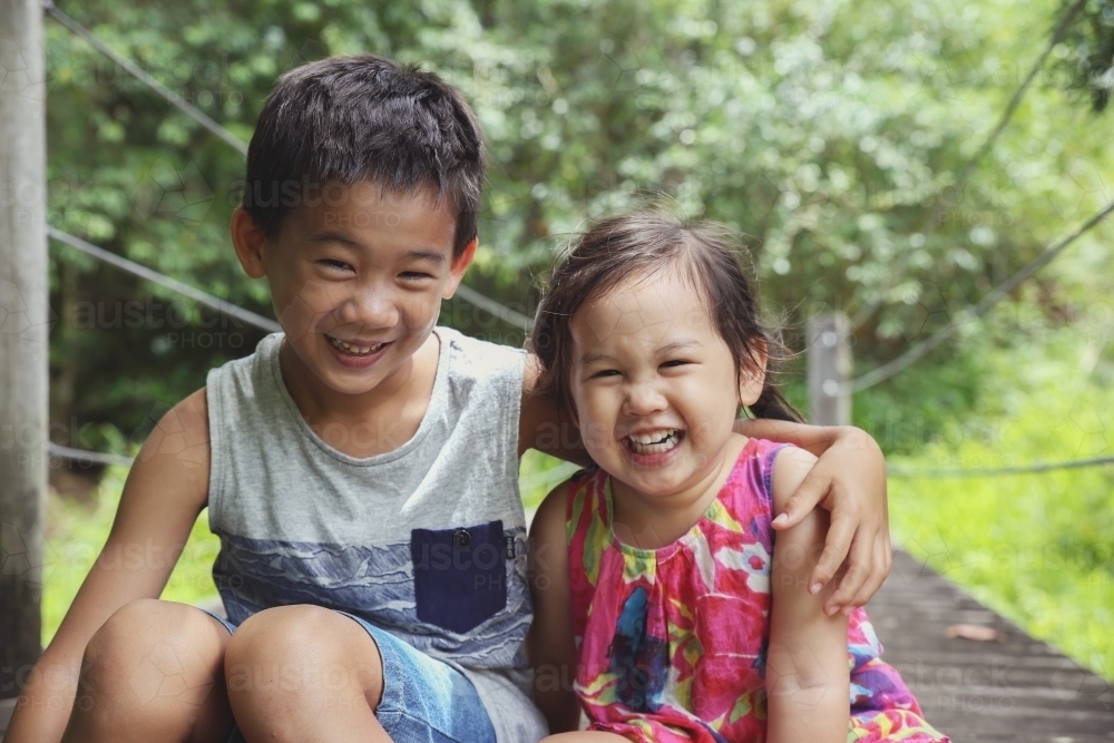 Happy multi ethnic brother and sister - Australian Stock Image