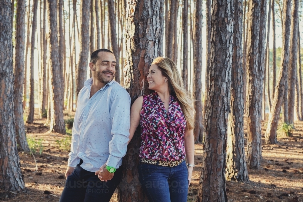Happy multicultural couples in the wood - Australian Stock Image