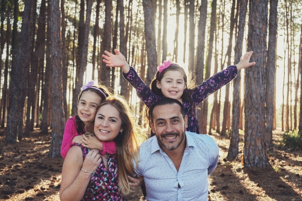 Happy multicultural family in the park - Australian Stock Image