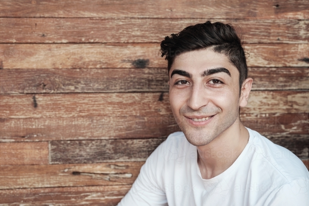 Happy multicultural young adult man, university student : Austockphoto Happy multicultural young adult man, university student - Australian Stock Image