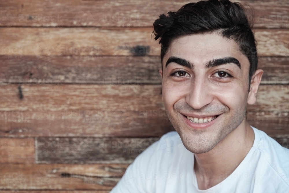 Happy multicultural young adult man, university student - Australian Stock Image