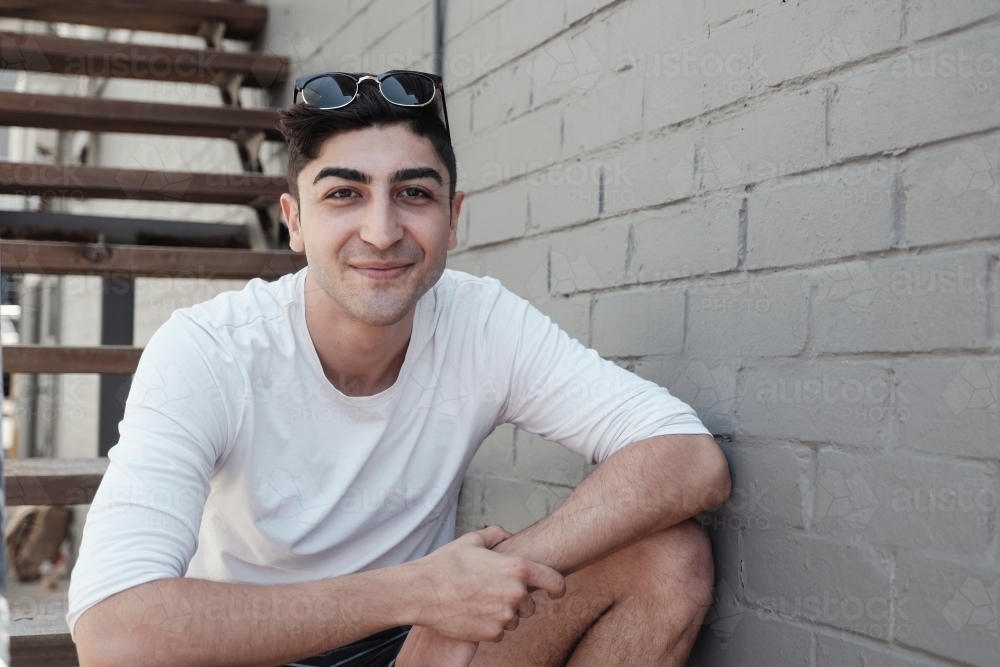 Happy multicultural young adult man, university student - Australian Stock Image