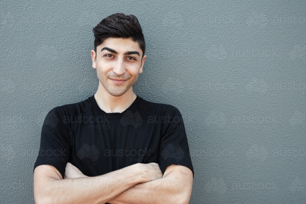 Happy multicultural young adult man, university student : Austockphoto Happy multicultural young adult man, university student - Australian Stock Image
