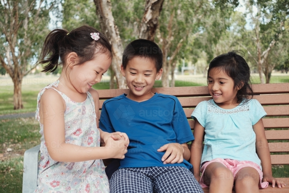 Happy multicultural young children at park - Australian Stock Image