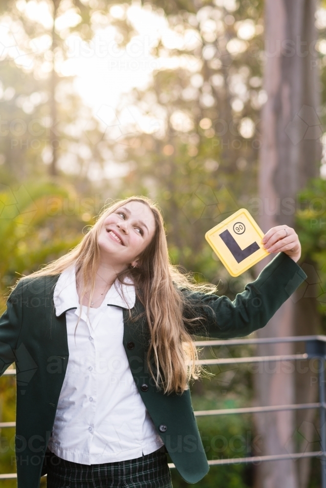 happy new learner driver with L-plate - Australian Stock Image