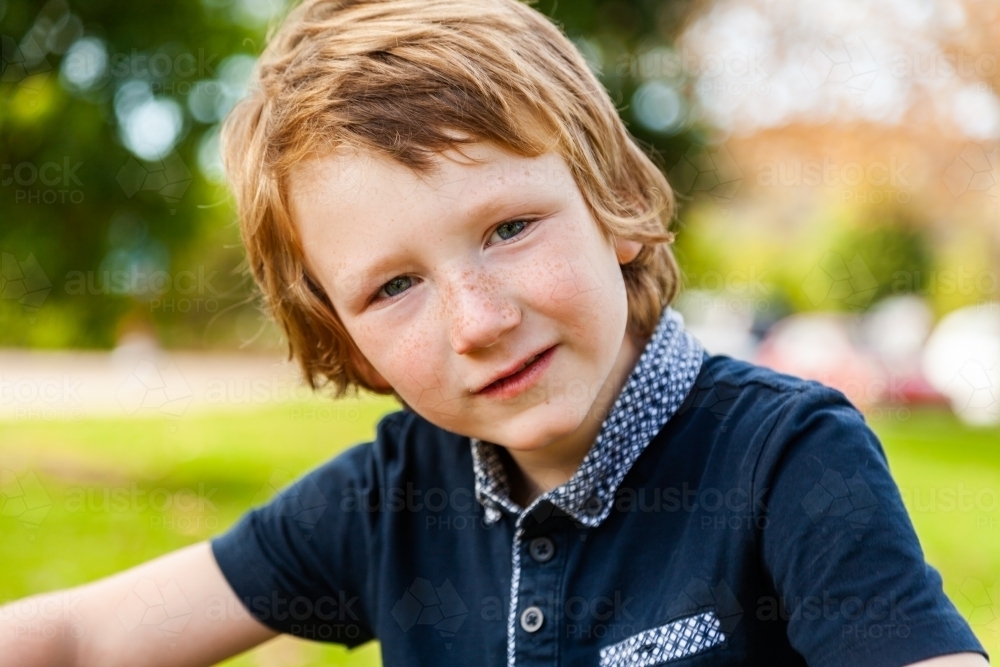 happy portrait close up of boy with autism spectrum disorder - Australian Stock Image