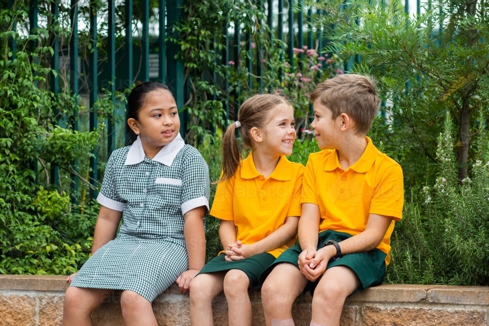 happy primary school children outside - Australian Stock Image