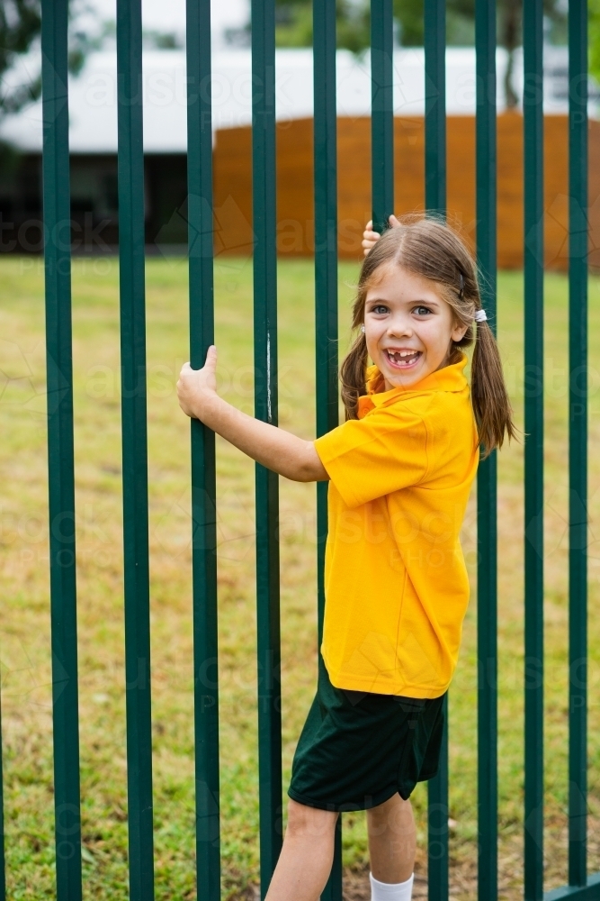 Image of happy school girl outside - Austockphoto