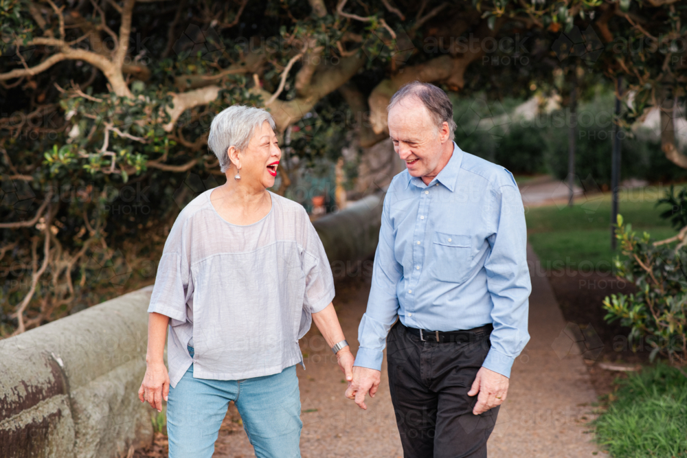 happy Senior Couple Stroll - Australian Stock Image