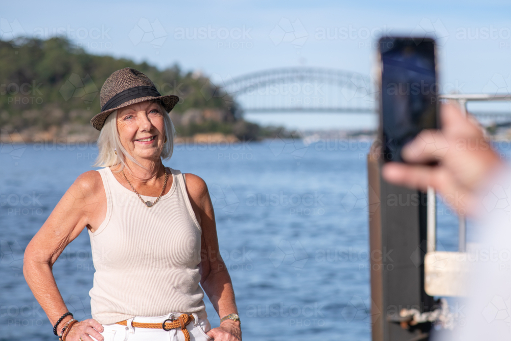 happy senior woman posing for a photo - Australian Stock Image