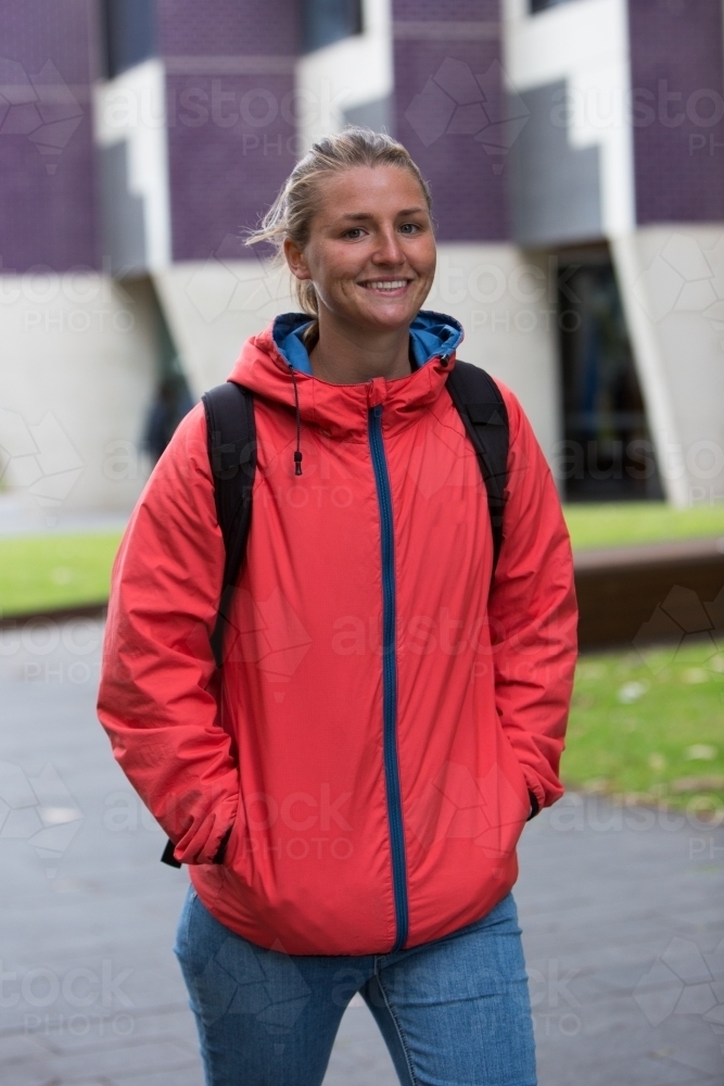 Happy Student Walking Through Campus - Australian Stock Image