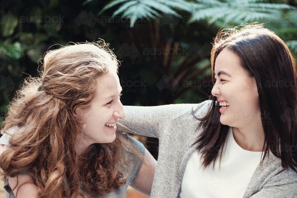 Happy students girl friends - Australian Stock Image