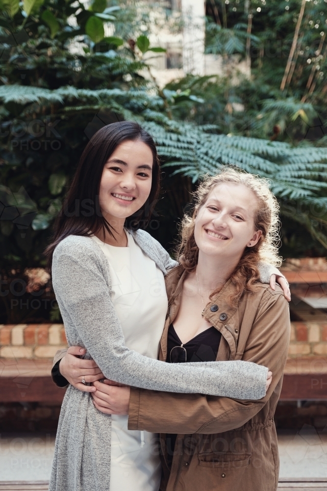 Happy students girl friends - Australian Stock Image