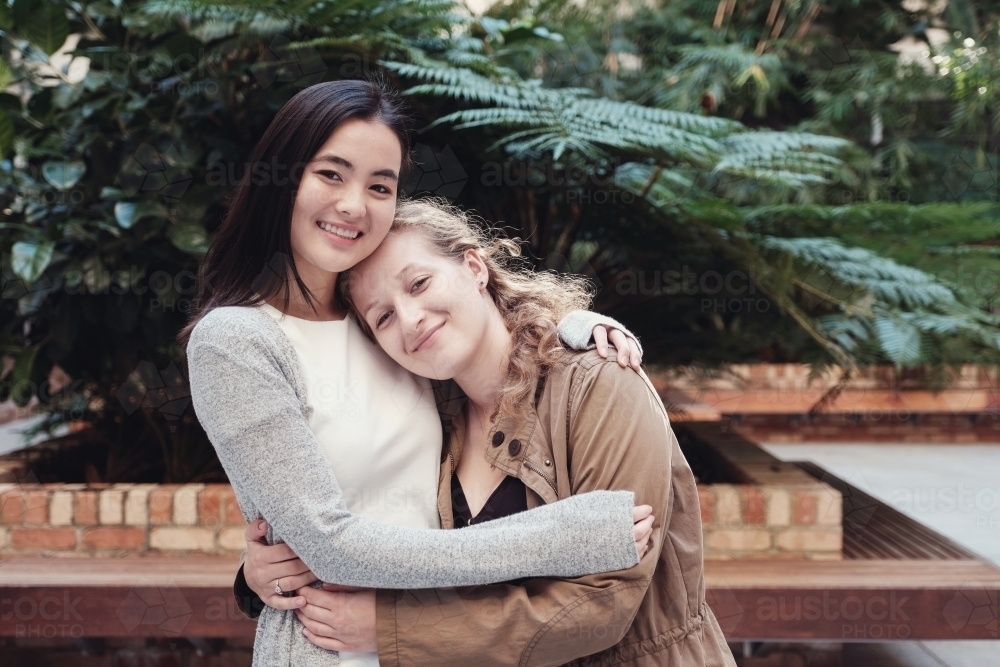 Happy students girl friends - Australian Stock Image