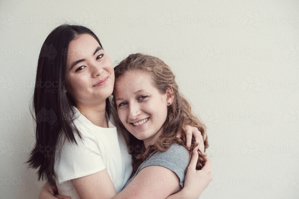 Happy students girl friends - Australian Stock Image