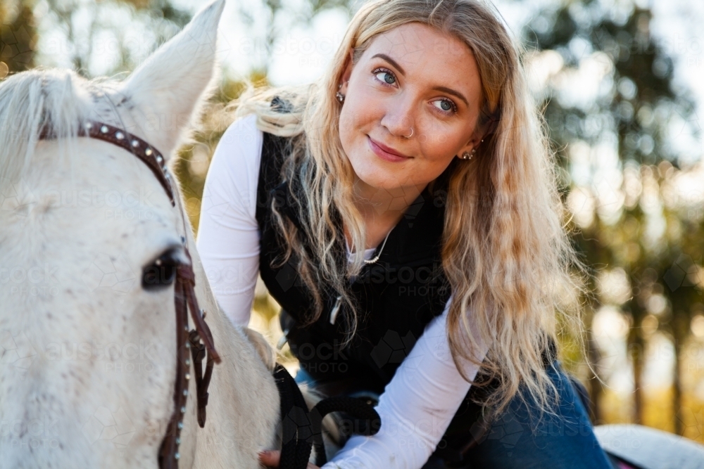 Happy teen horselover portrait close up - Australian Stock Image
