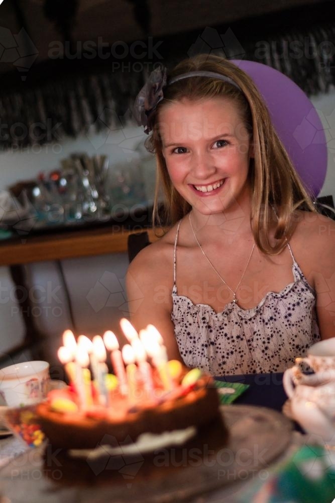 happy tween with birthday cake - Australian Stock Image