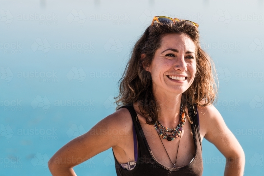 happy woman at ocean swimming pool - Australian Stock Image