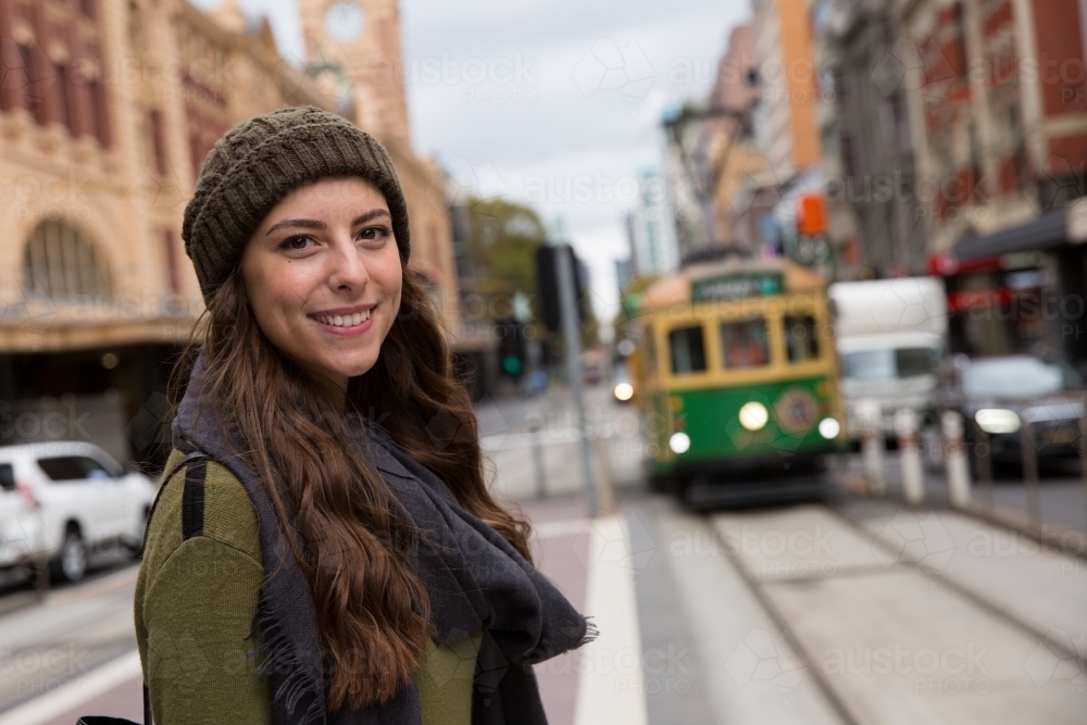 Happy Woman Waiting for Melbourne Tram - Australian Stock Image