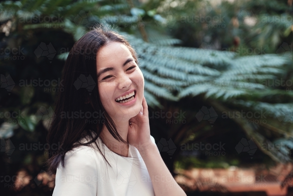 Happy young adult Asian student - Australian Stock Image