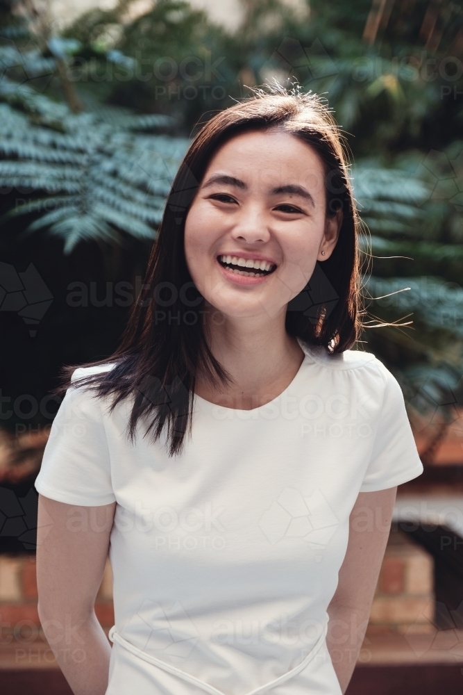 Happy young adult Asian student - Australian Stock Image