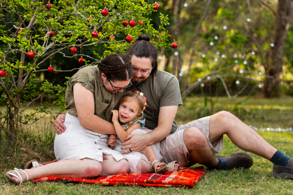 Image of Happy young australian family of three together at Christmas ...