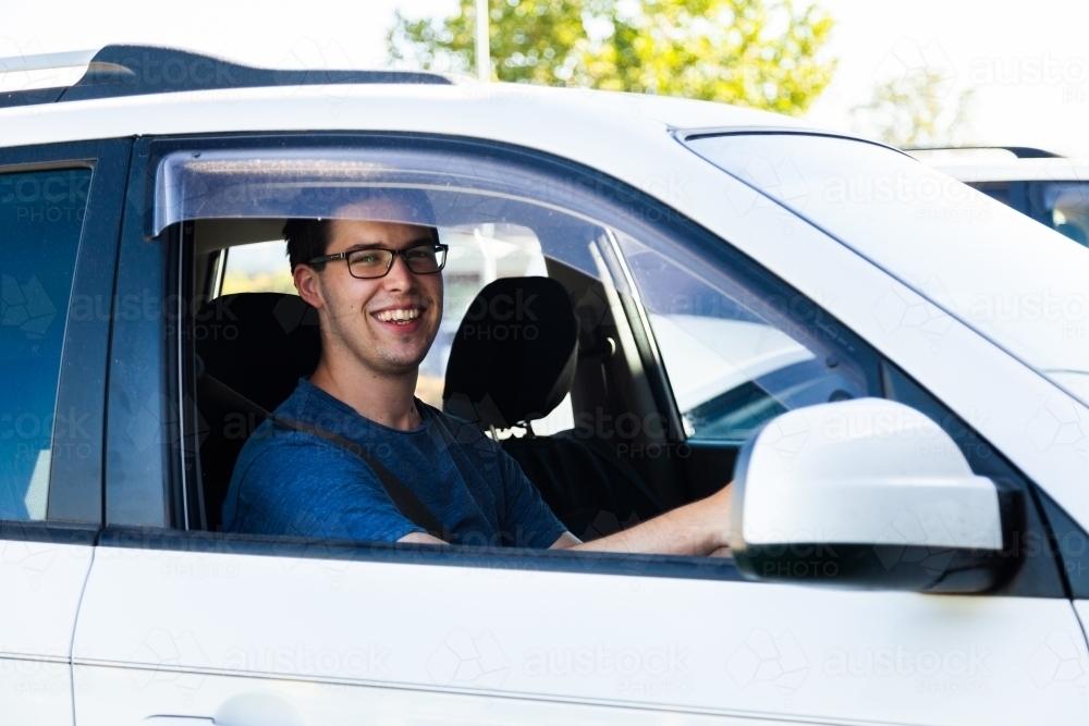 Happy young male driver - Australian Stock Image