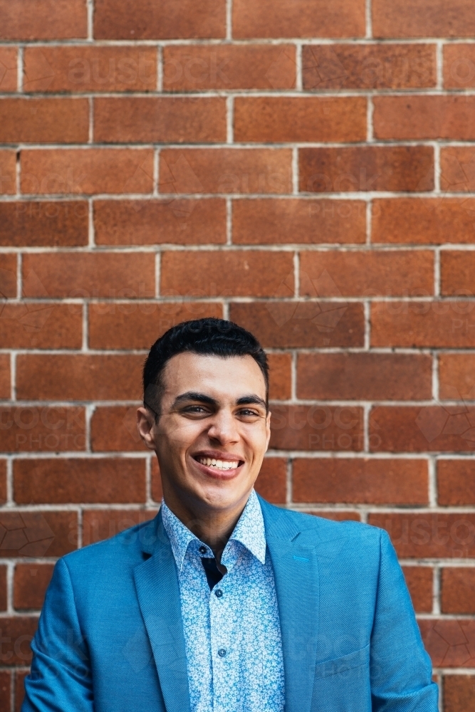 happy young man in a suit - Australian Stock Image
