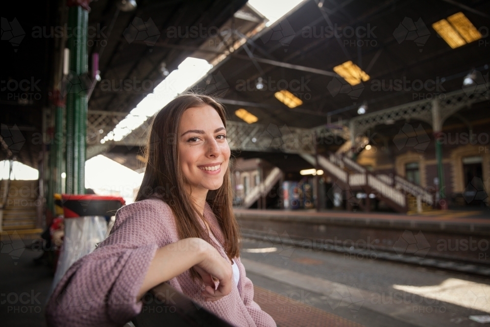 Happy Young Woman at Train Station - Australian Stock Image