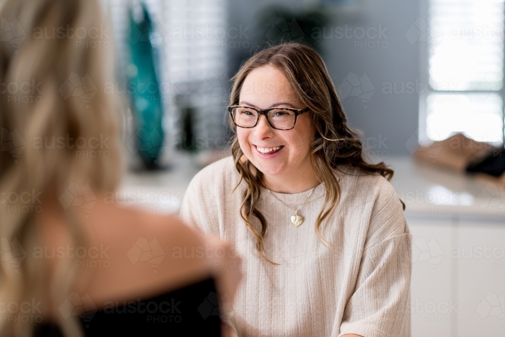 happy young woman. from a series featuring a woman with Down Syndrome - Australian Stock Image
