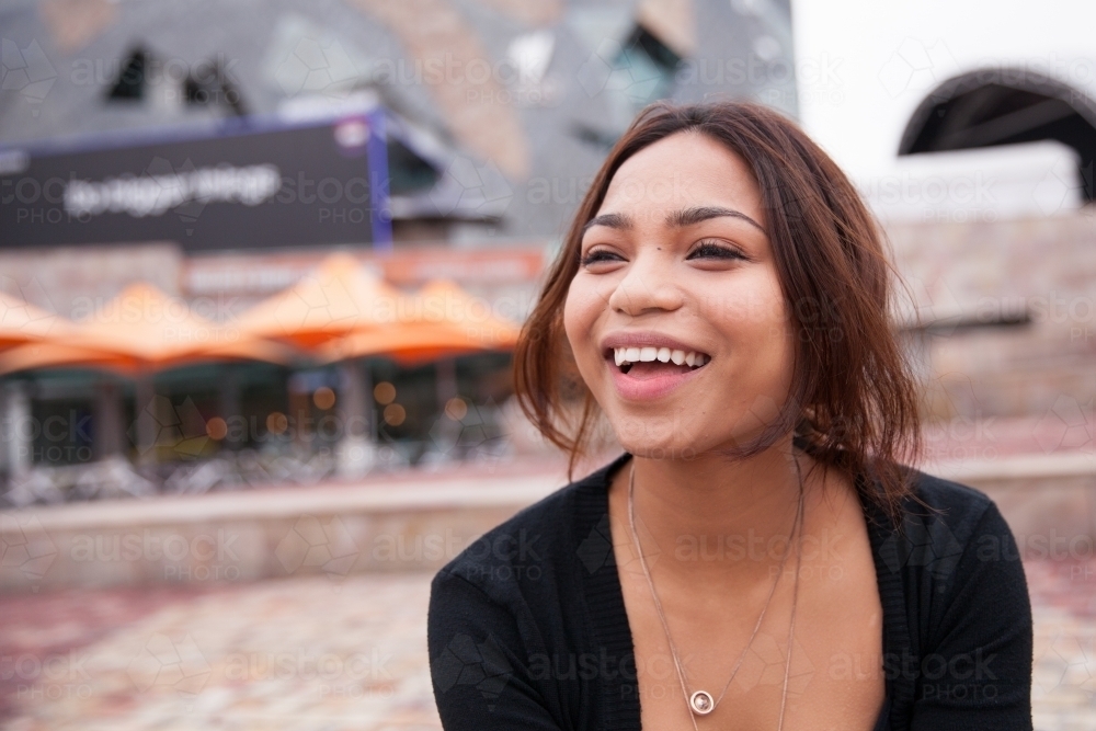Happy Young Woman in Federation Square - Australian Stock Image