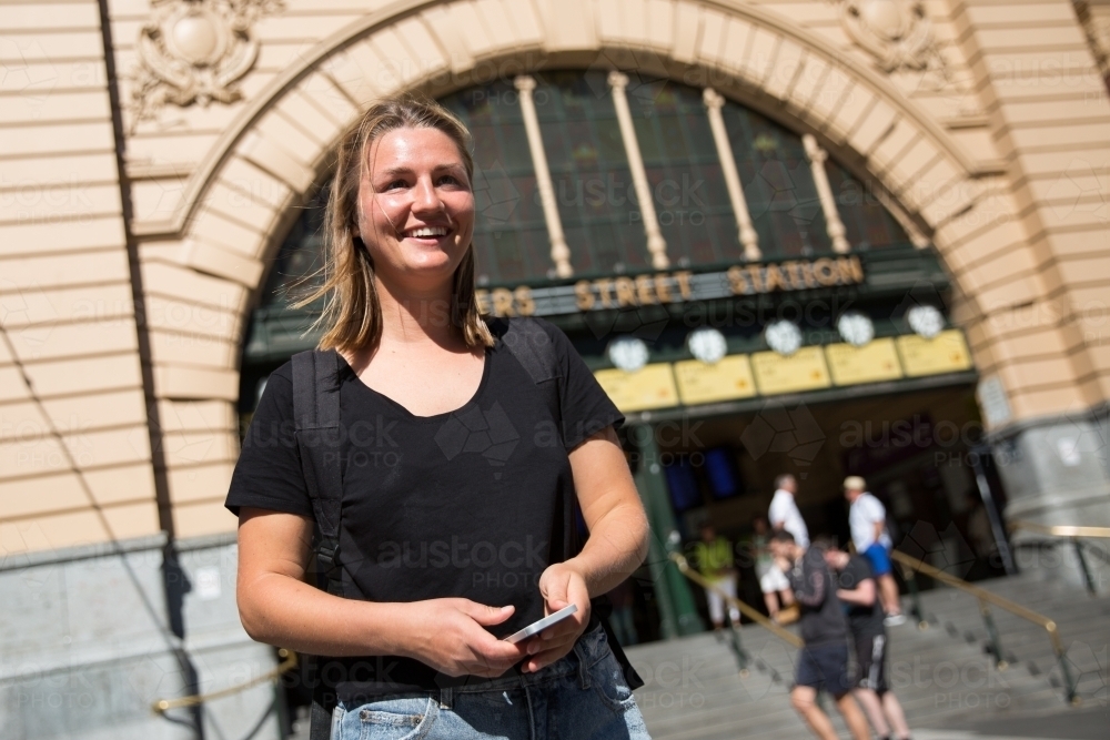 Happy Young Woman Waiting Outside Flinders Street Station - Australian Stock Image