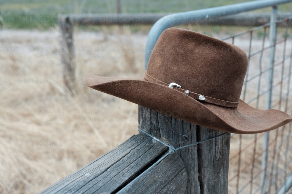 Hat on a fence post - Australian Stock Image