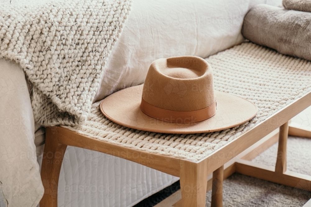 Hat sits on a bench seat - Australian Stock Image