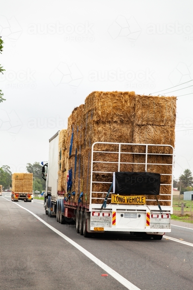 Hay in road train being transported across Australia to aid farmers in drought - Australian Stock Image